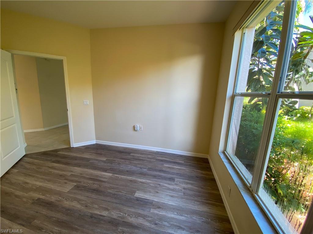 1993 Crestview Way, Unit 129 Naples, FL 34119 - Photo 14 of 26 a view of an empty room and glass door