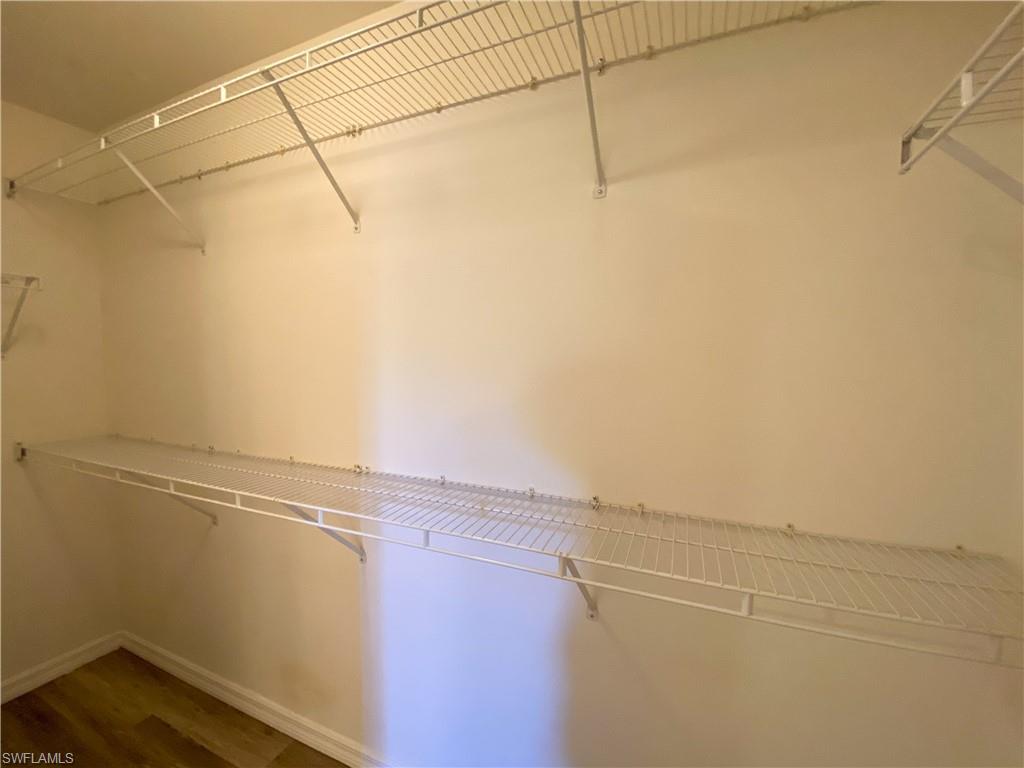 1993 Crestview Way, Unit 129 Naples, FL 34119 - Photo 16 of 26 a view of a room with racks on the wall