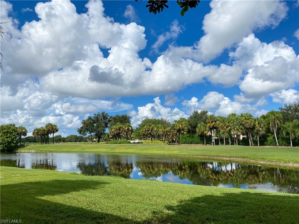 1993 Crestview Way, Unit 129 Naples, FL 34119 - Photo 2 of 26 a view of a lake