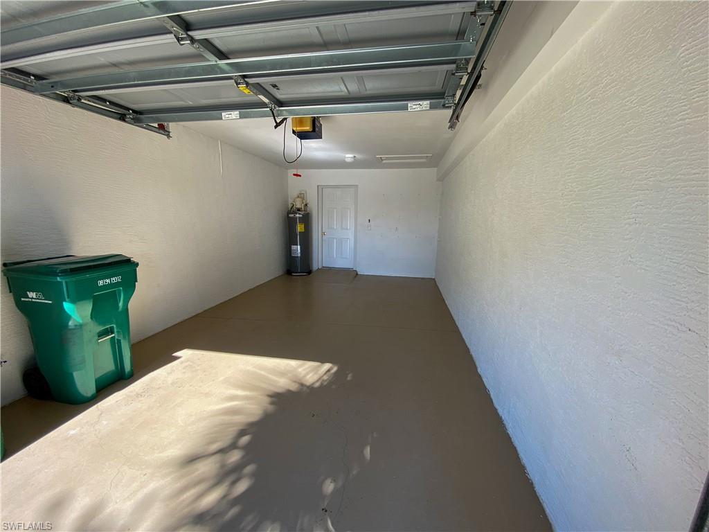 1993 Crestview Way, Unit 129 Naples, FL 34119 - Photo 22 of 26 a view of a room with lots of wooden cabinets
