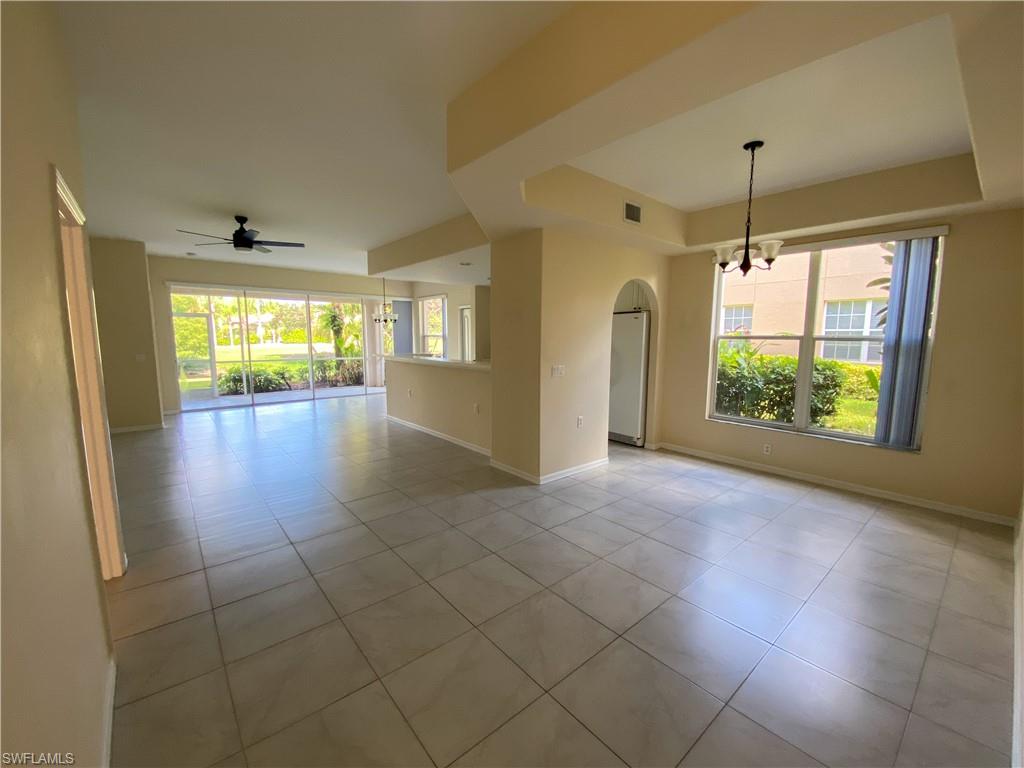 1993 Crestview Way, Unit 129 Naples, FL 34119 - Photo 7 of 26 a view of an empty room with a window