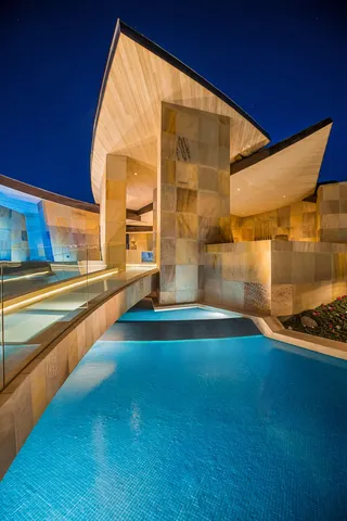 a view of a swimming pool with outdoor seating