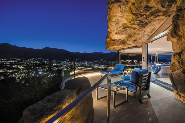 a living room with fireplace furniture and a fireplace