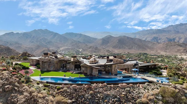 a view of a town with mountains in the background