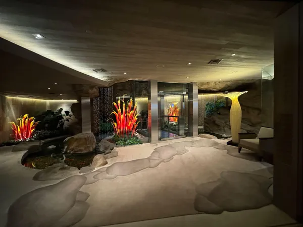 a room with lots of gym equipment and a large window