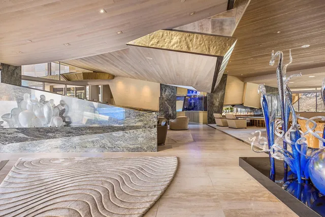 a lobby with furniture and a rug