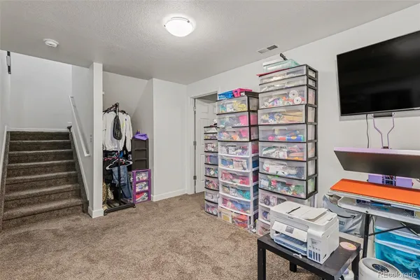 a room with furniture and a flat screen tv