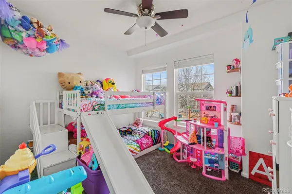 a bedroom with toys and a bed