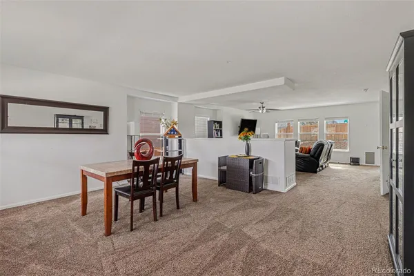 a view of a livingroom with furniture and white walls