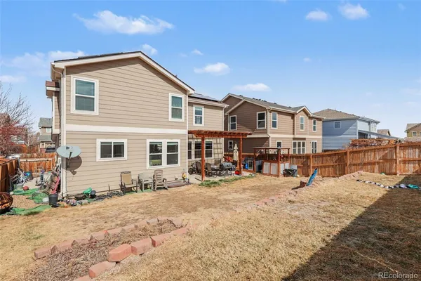 a view of a house with chairs in front of house