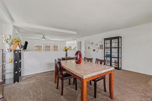 a view of a dining room with furniture
