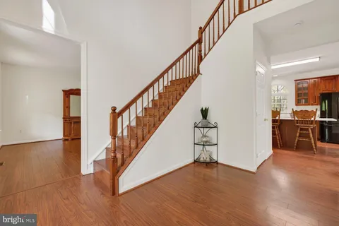 a kitchen with stainless steel appliances granite countertop a refrigerator stove microwave and sink