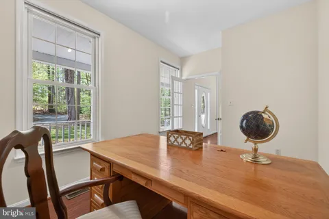 a view of a room with wooden floor