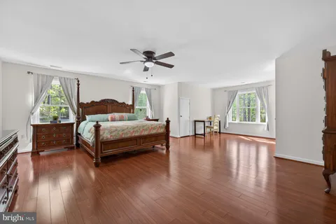 a bed room with a bed and a window