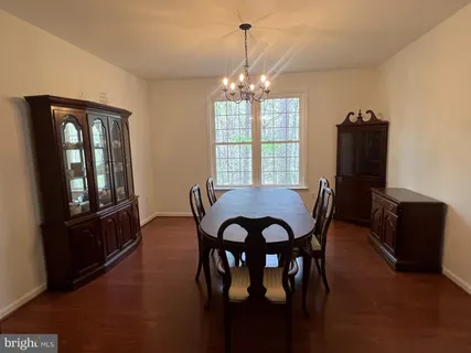 a view of a dining room with furniture and window