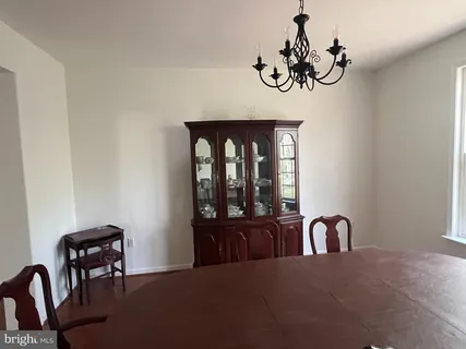 a view of a livingroom with furniture and window