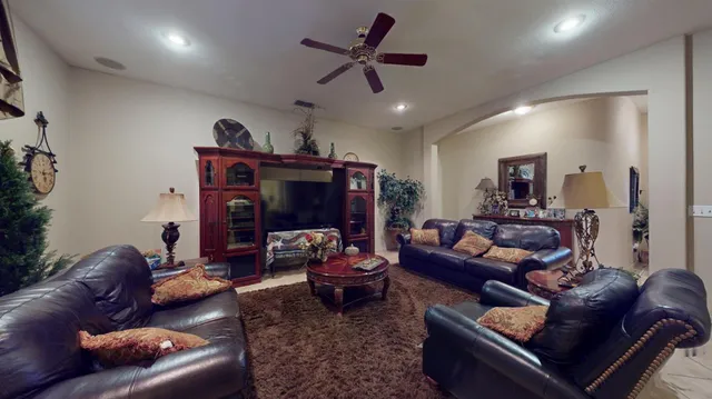 a living room with furniture and a fireplace