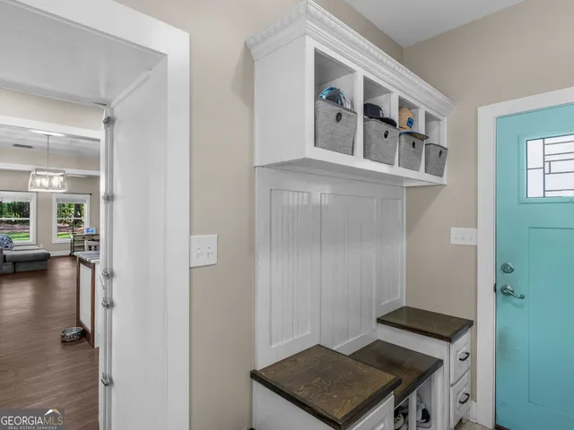 a view of a workspace with furniture and an entryway