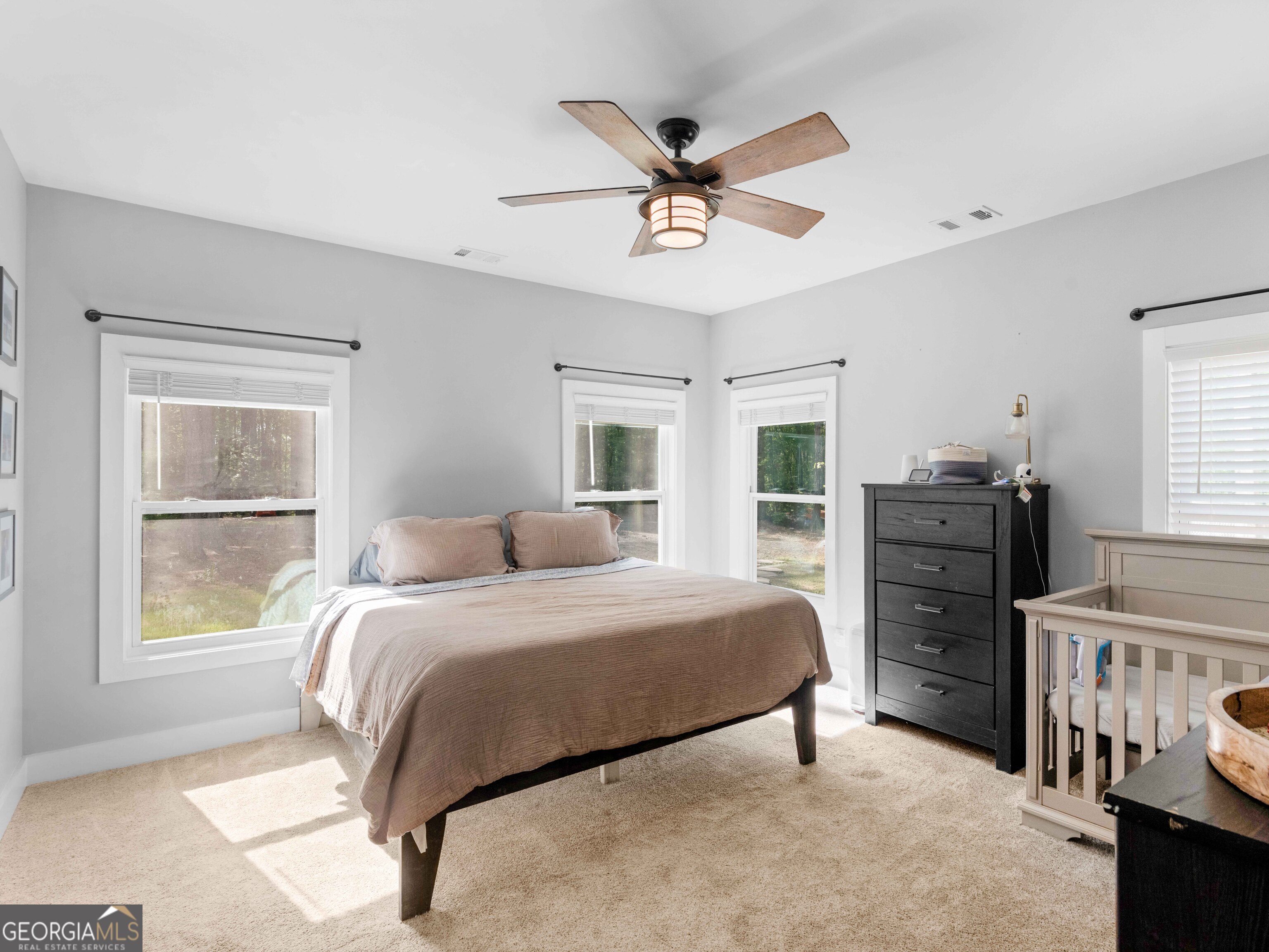 180 Preservation Avenue Jackson, GA 30233 - Photo 13 of 27 a bedroom with a bed dresser and a window
