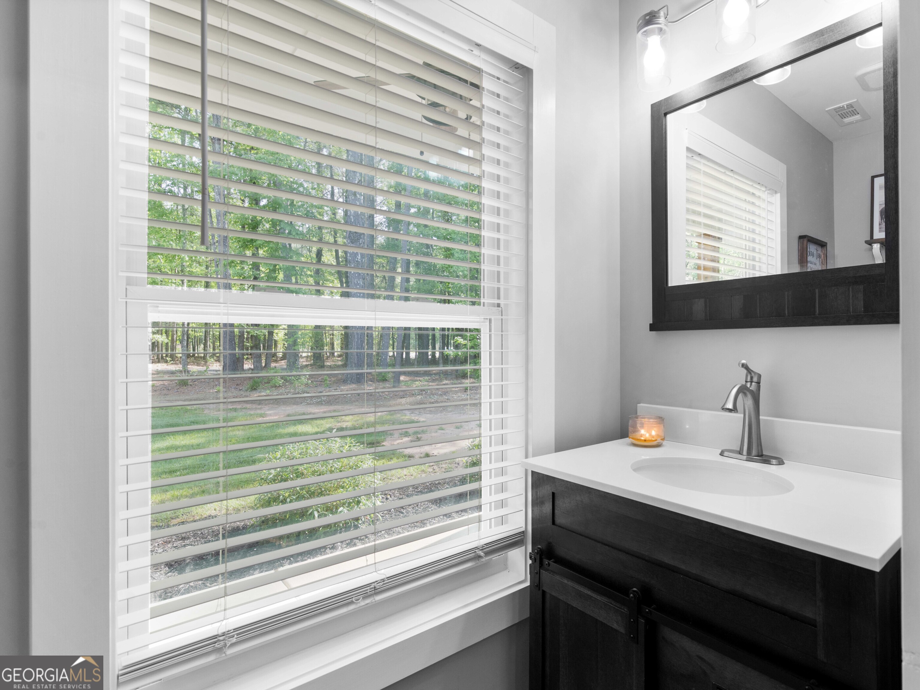 180 Preservation Avenue Jackson, GA 30233 - Photo 15 of 27 a bathroom with a sink and a mirror