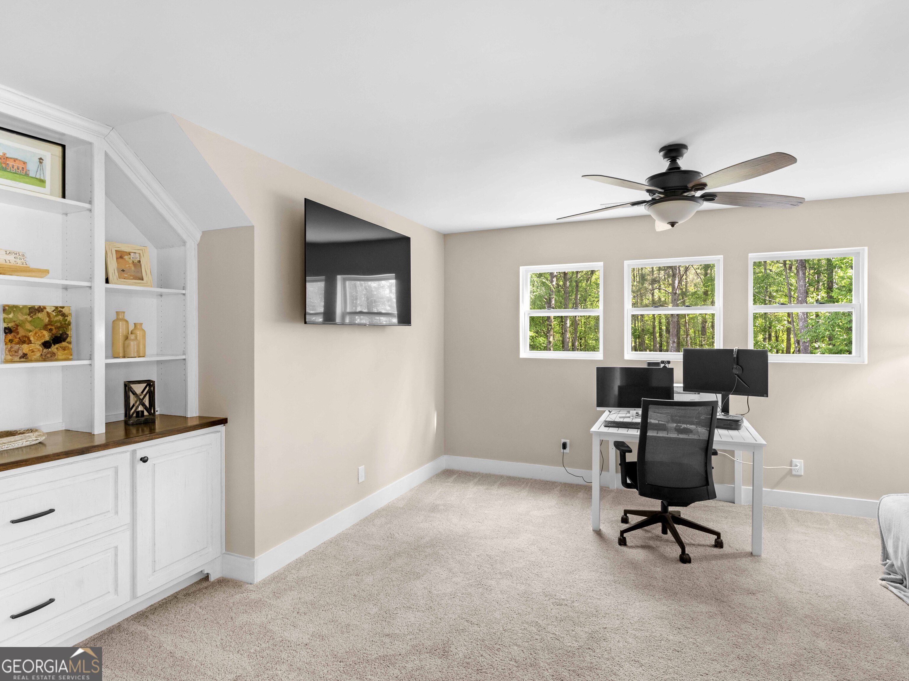 180 Preservation Avenue Jackson, GA 30233 - Photo 16 of 27 a view of a workspace with furniture and a window