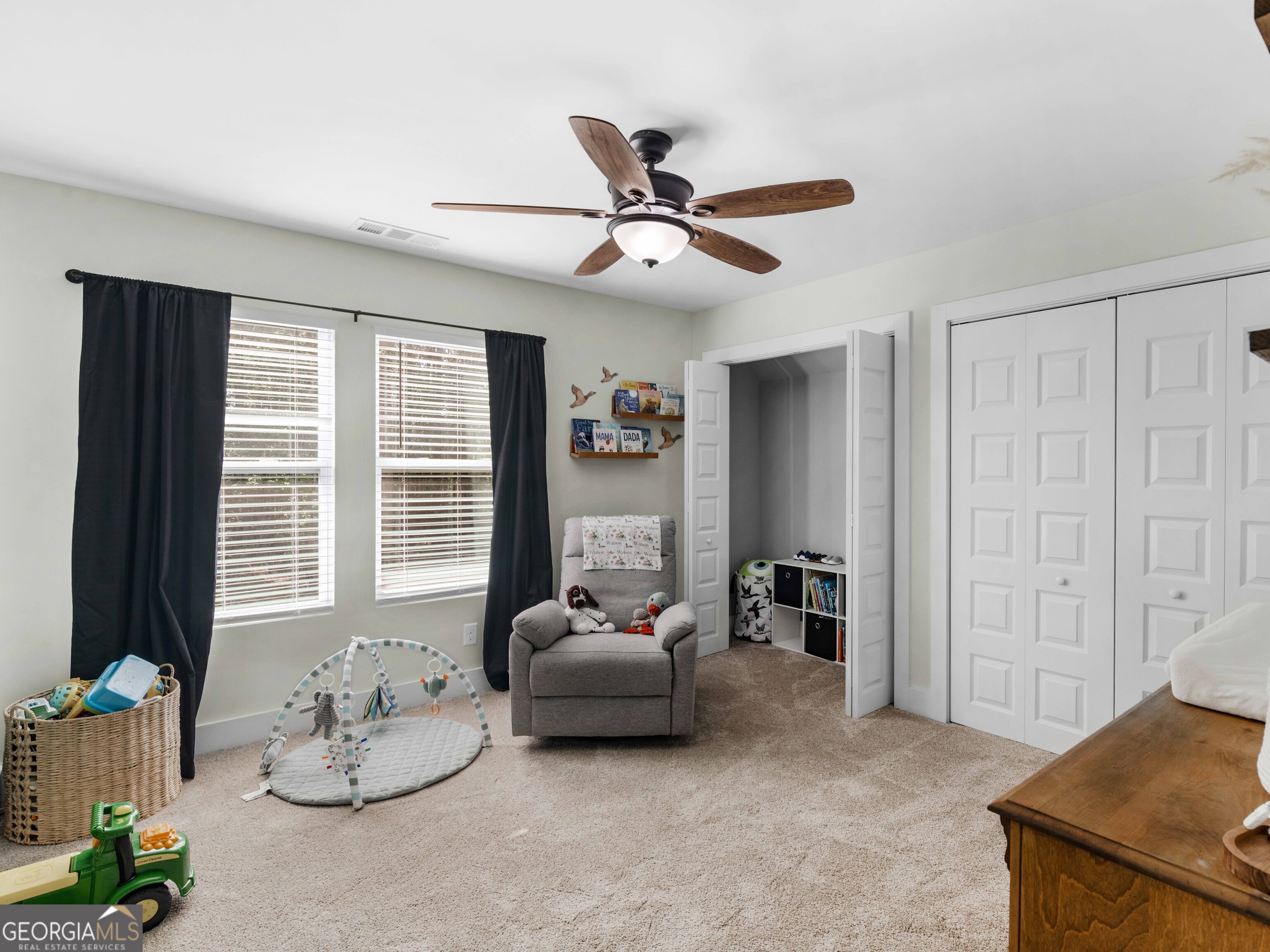 180 Preservation Avenue Jackson, GA 30233 - Photo 19 of 27 a living room with furniture stairs and a window