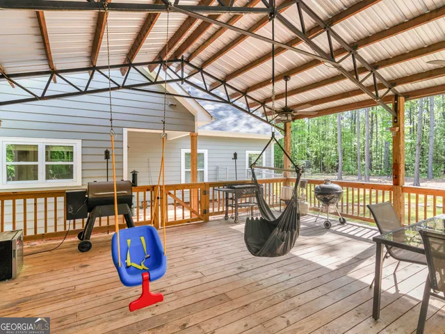 a view of a two chairs in the deck