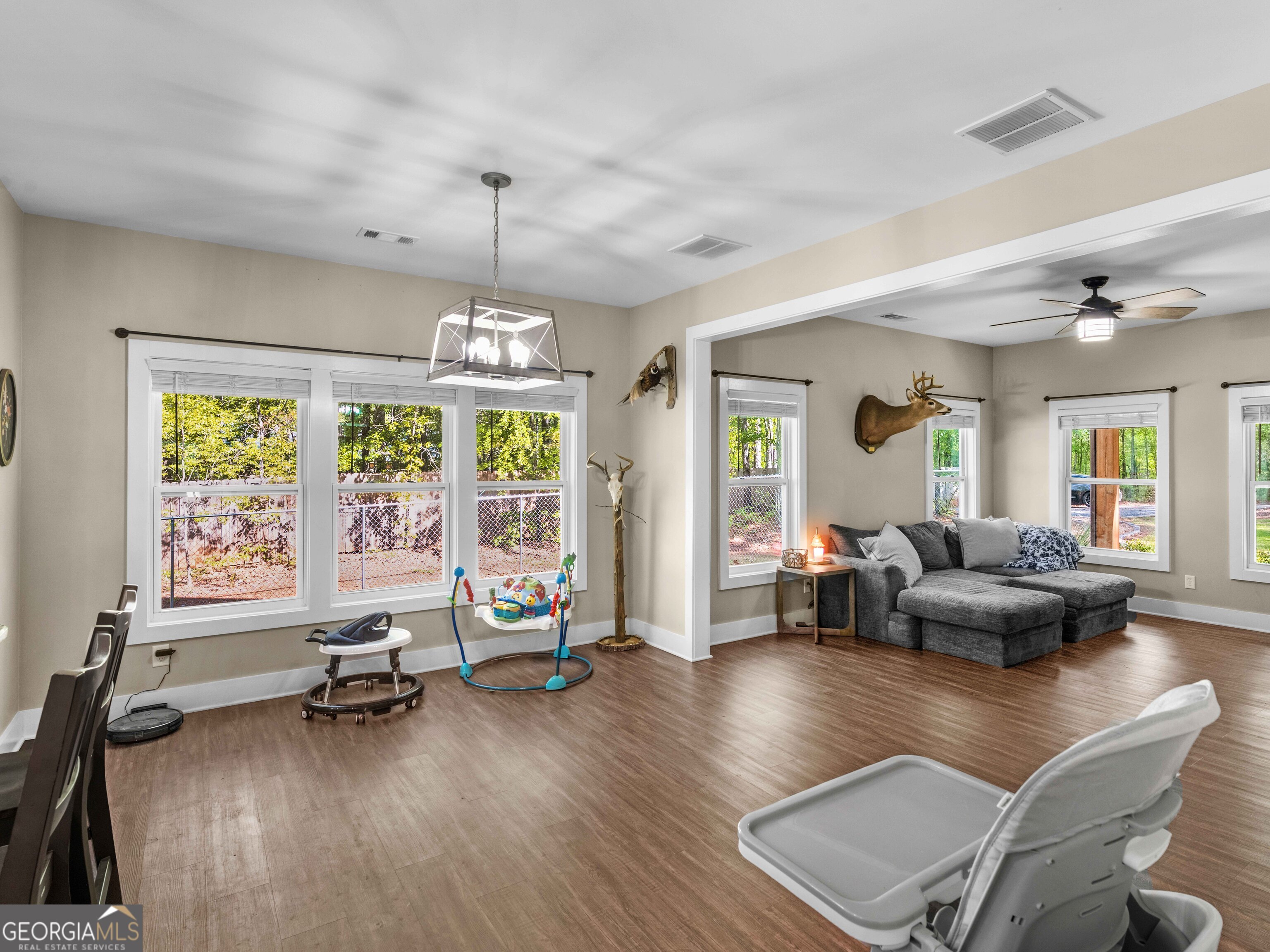 180 Preservation Avenue Jackson, GA 30233 - Photo 7 of 27 a living room with furniture and a large window