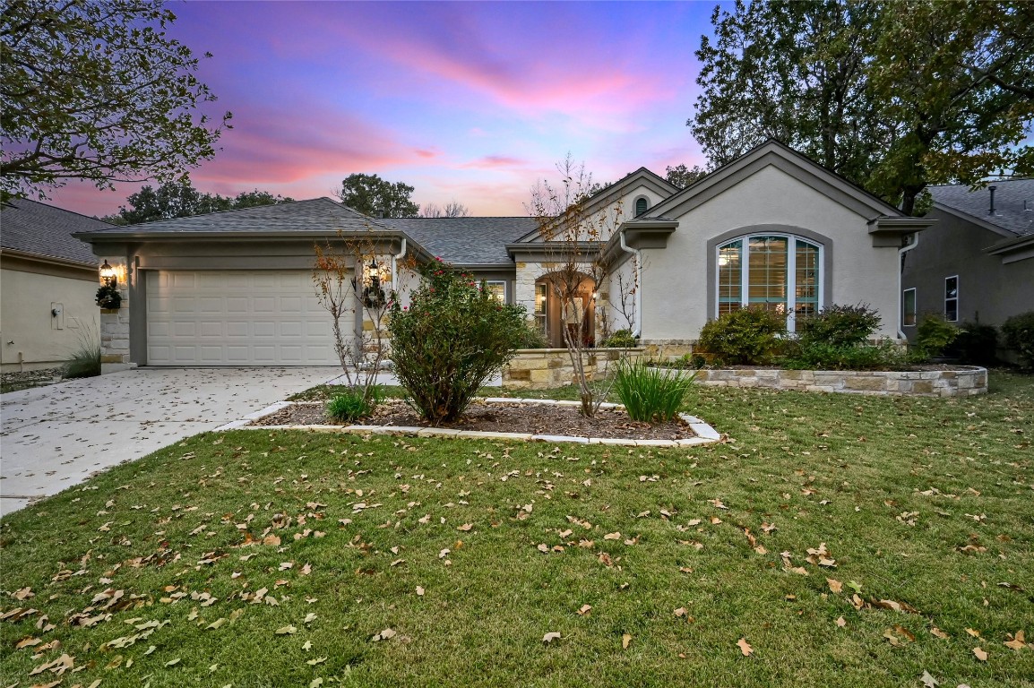 208 River Rock Drive Georgetown, TX 78633 - Photo 1 of 1 a front view of a house with a yard and garage