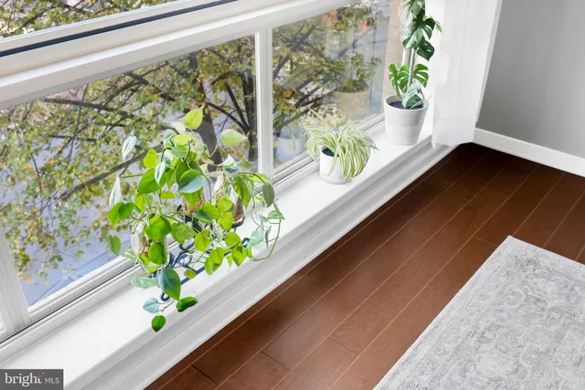 a bedroom with bed and wall painting