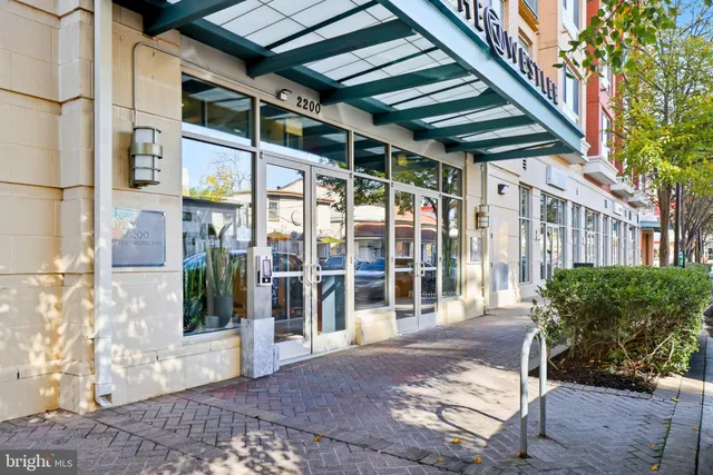 a view of a porch with a table and chairs
