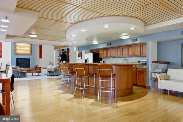 a view of a chairs and table in the back yard of the house