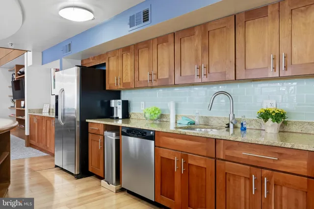 a view of a patio with table and chairs and potted plants