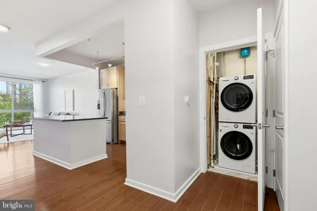 a kitchen with stainless steel appliances granite countertop a stove a microwave and wooden cabinets
