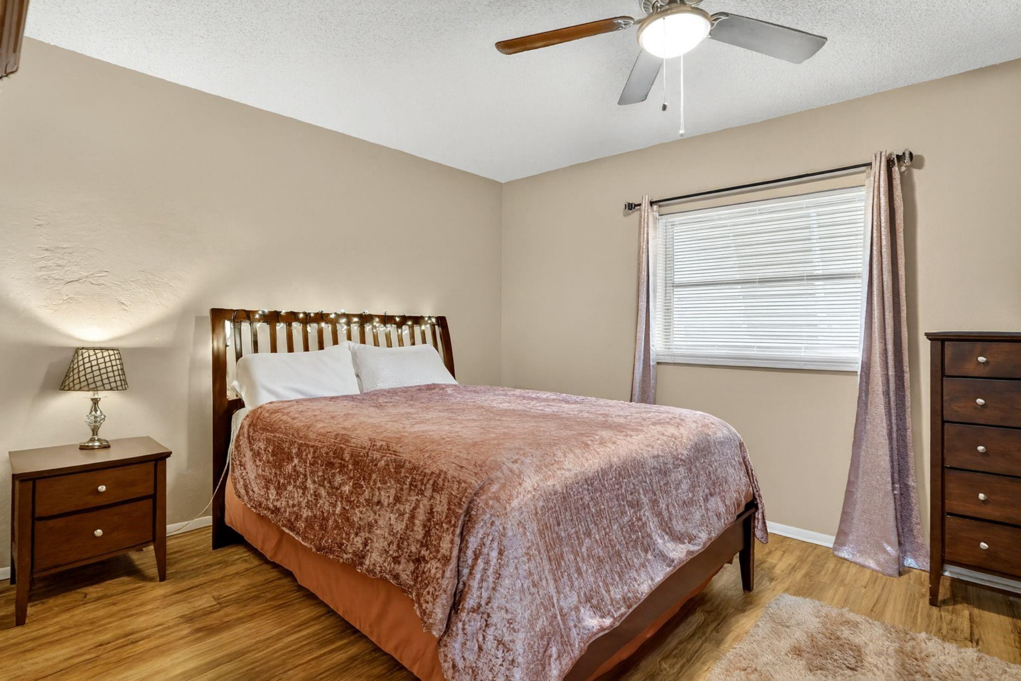 9806 Northwest 71st Street Tamarac, FL 33321 - Photo 14 of 23 a bedroom with a bed and a dresser