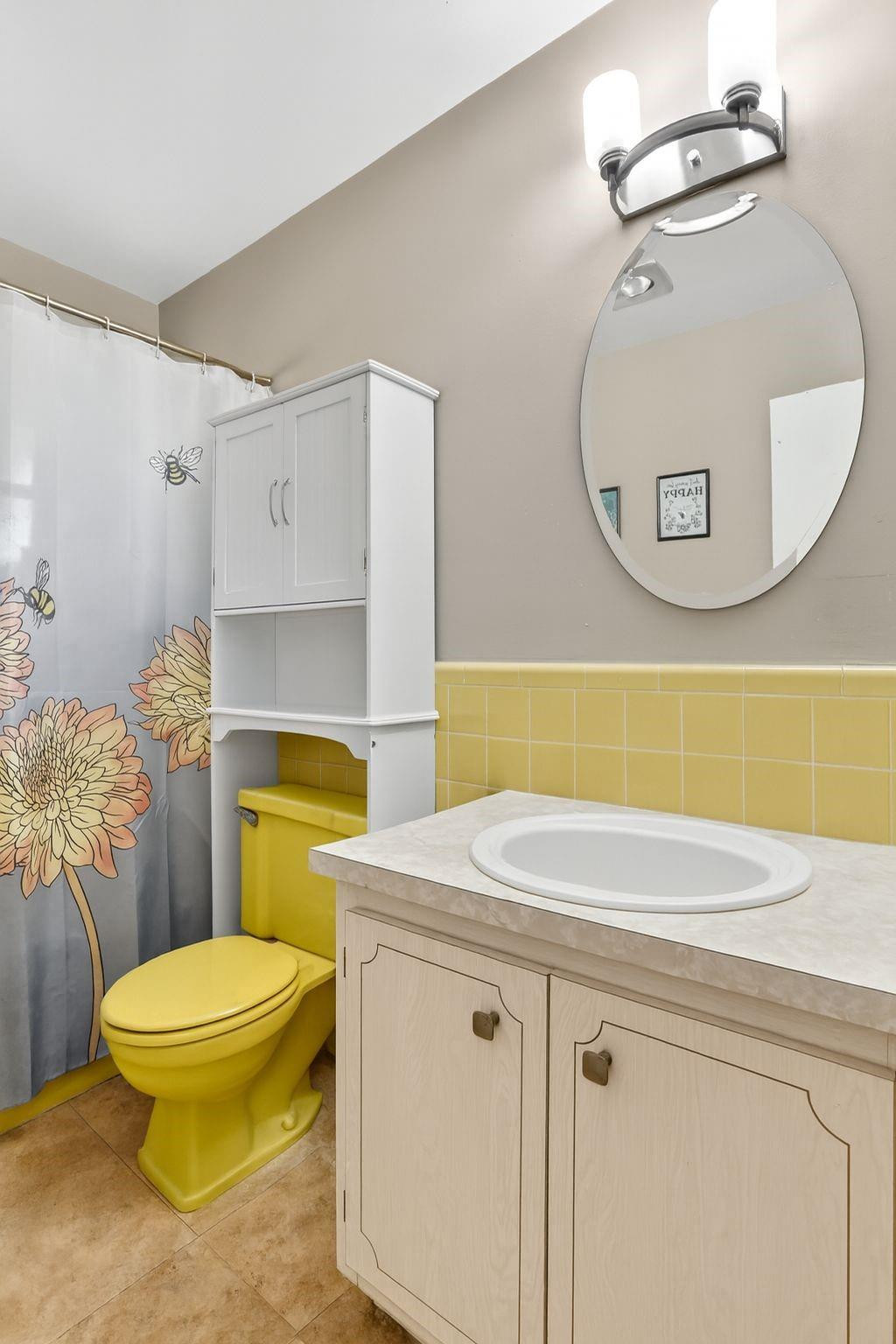 9806 Northwest 71st Street Tamarac, FL 33321 - Photo 15 of 23 a bathroom with a sink mirror vanity and toilet