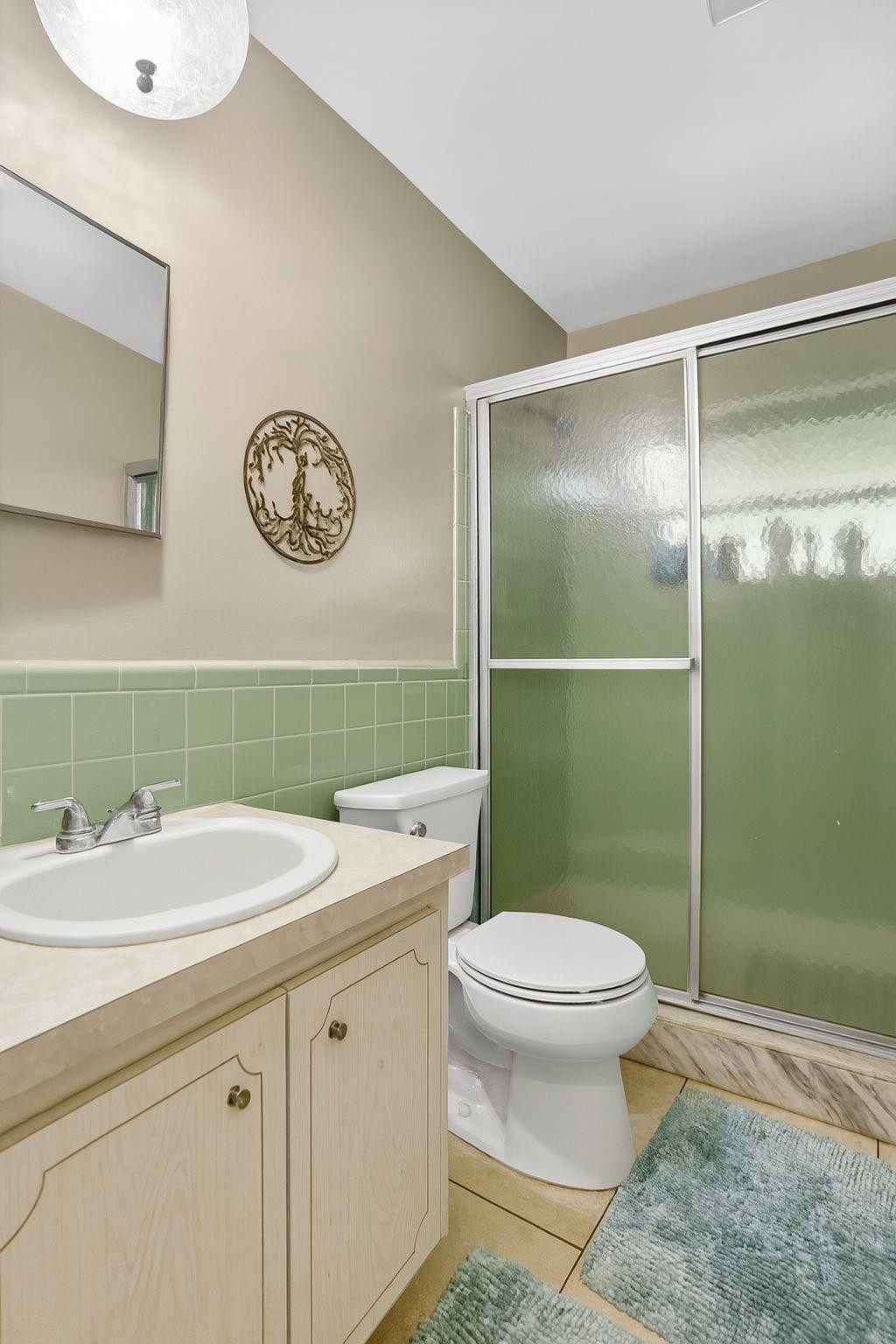 9806 Northwest 71st Street Tamarac, FL 33321 - Photo 17 of 23 a bathroom with a sink and a mirror