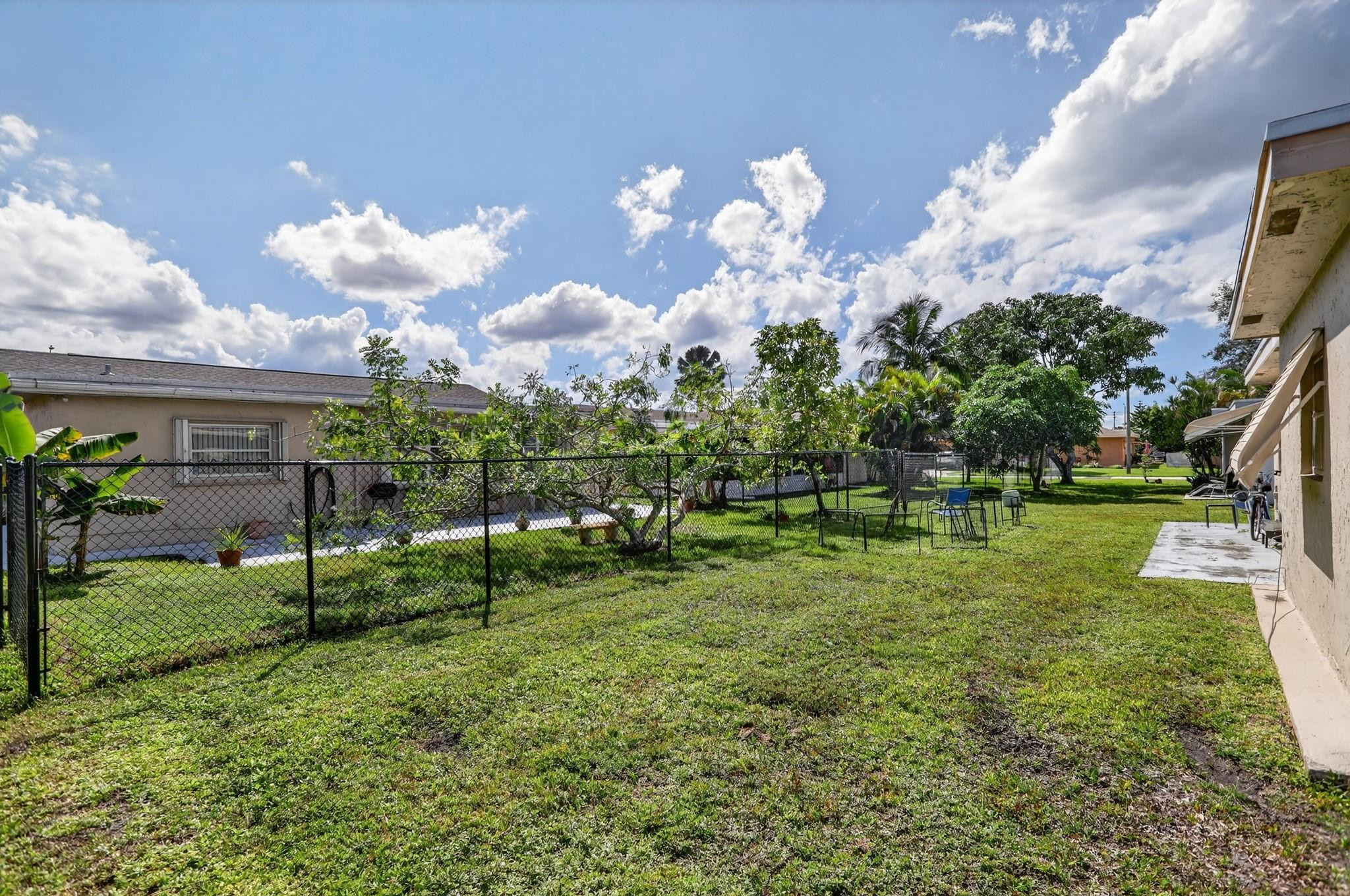 9806 Northwest 71st Street Tamarac, FL 33321 - Photo 23 of 23 a view of a park with large trees