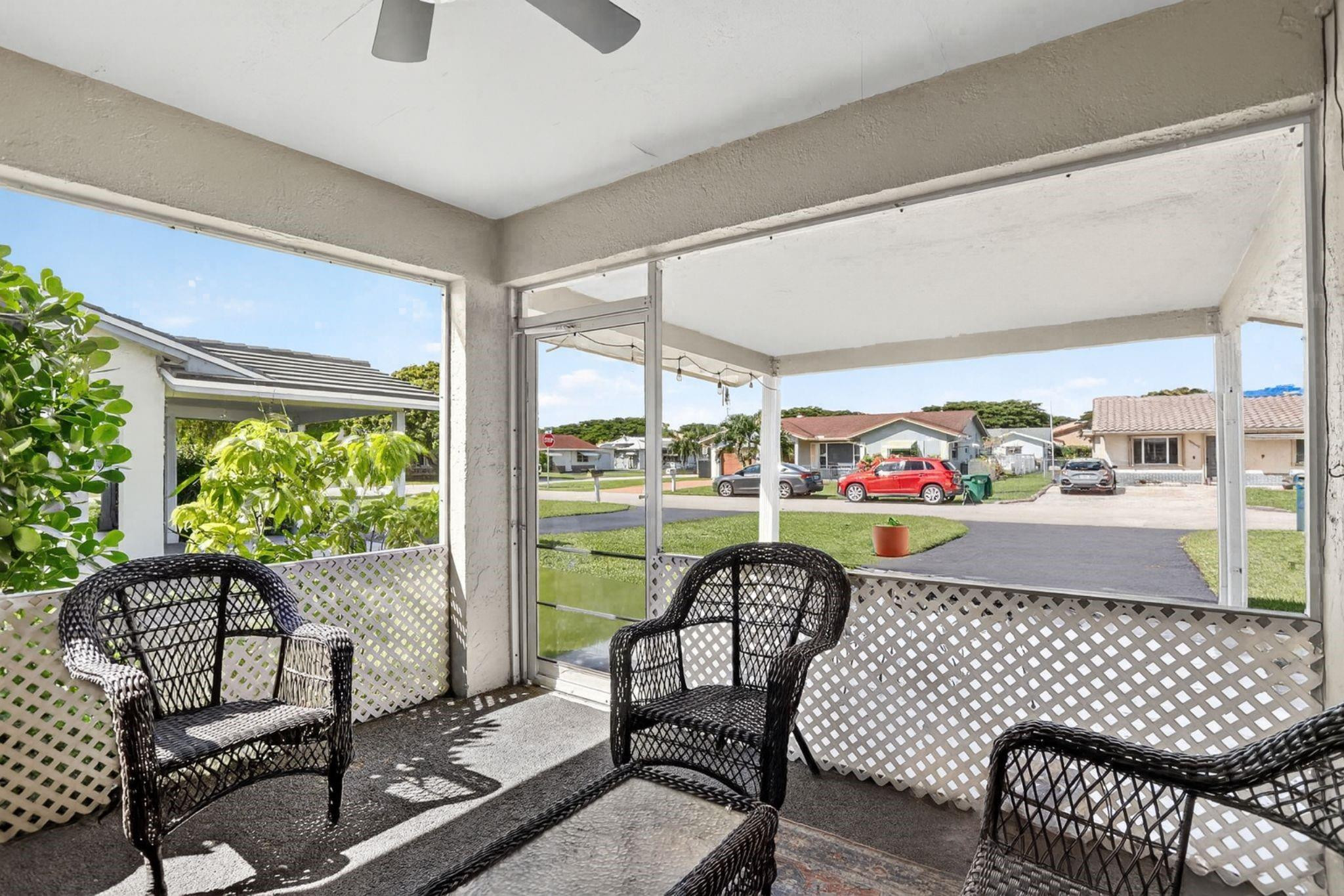 9806 Northwest 71st Street Tamarac, FL 33321 - Photo 4 of 23 a outdoor living space with furniture and garden view