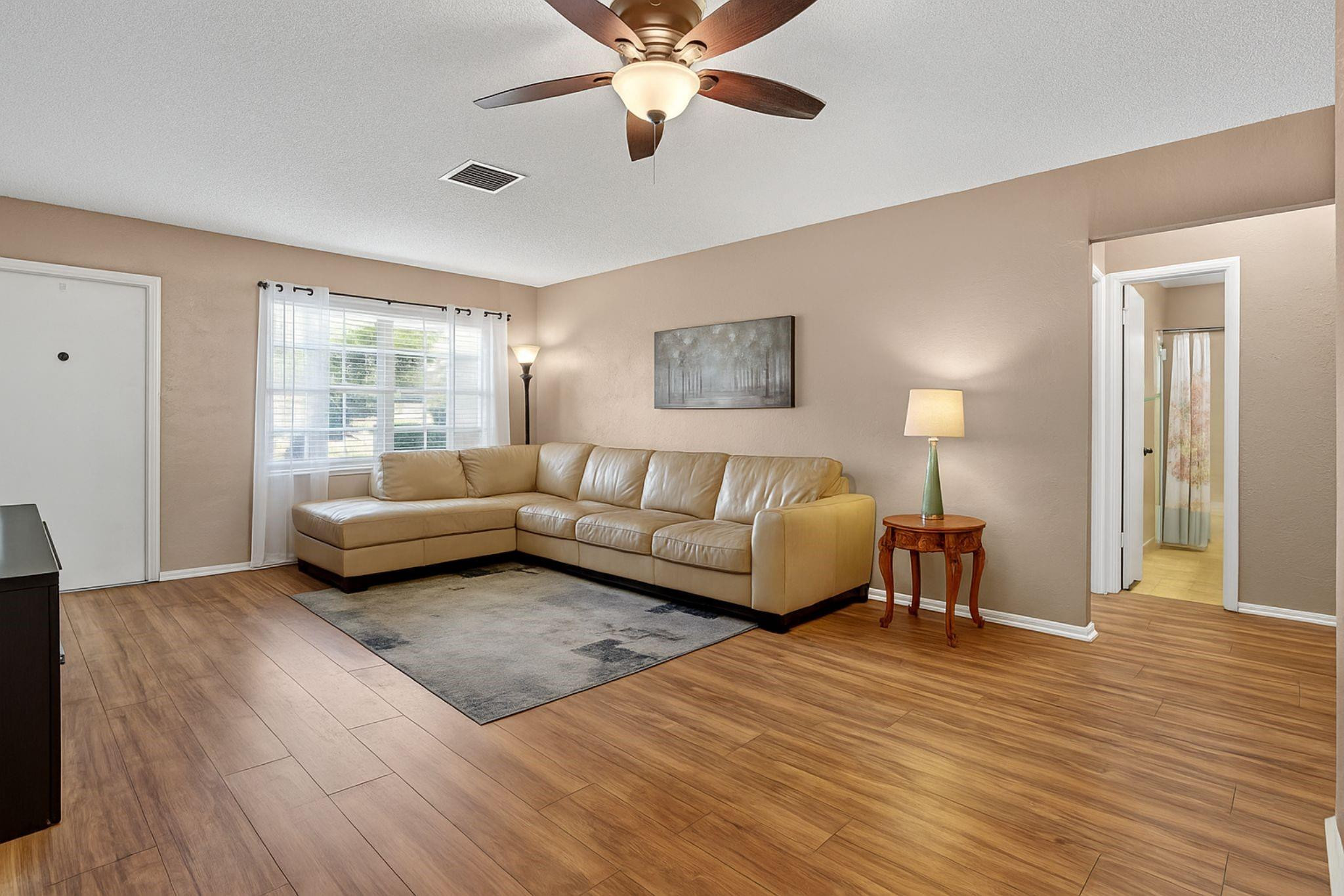 9806 Northwest 71st Street Tamarac, FL 33321 - Photo 7 of 23 a living room with furniture and a wooden floor