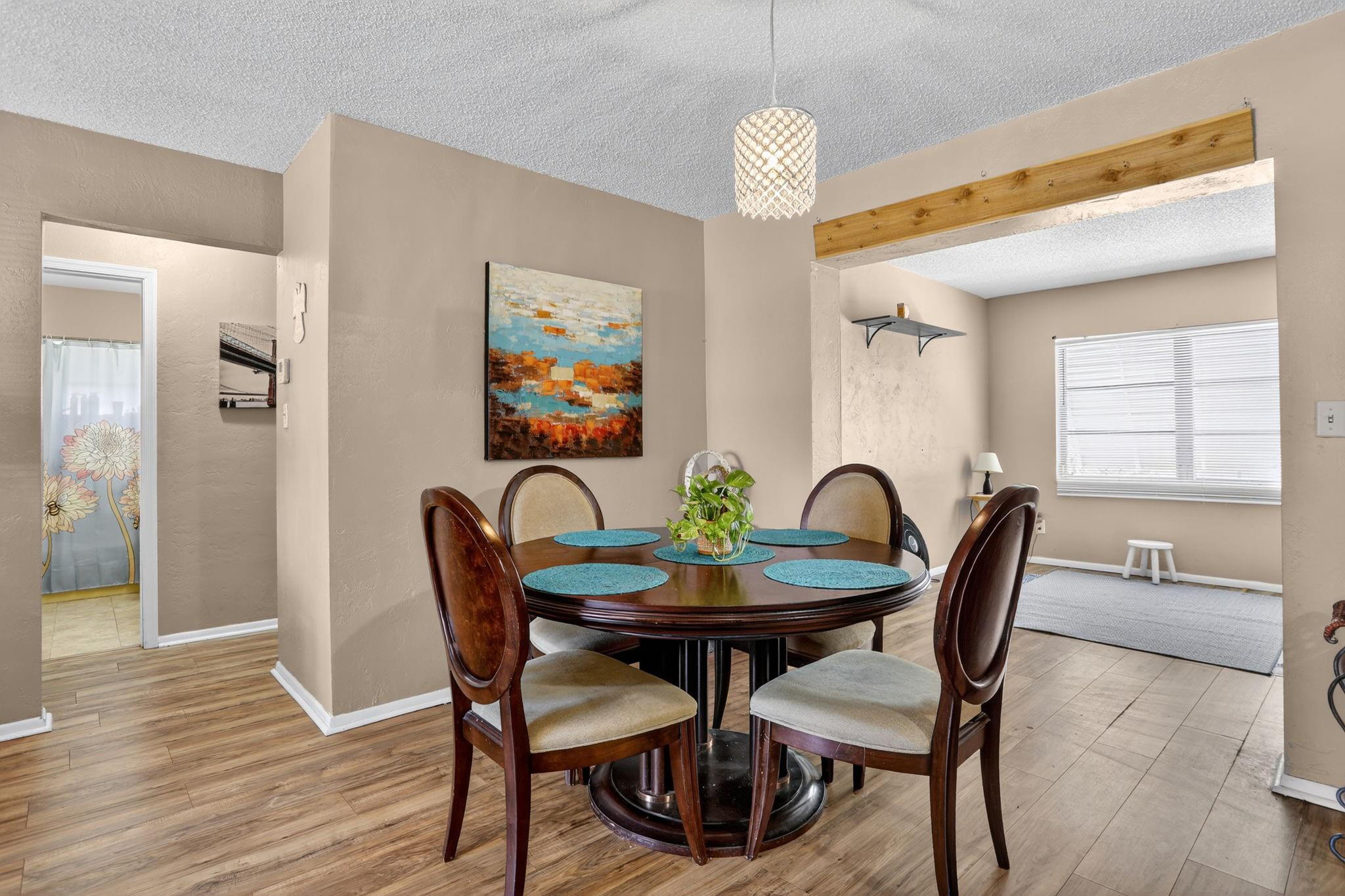 9806 Northwest 71st Street Tamarac, FL 33321 - Photo 8 of 23 a view of a dining room with furniture window and wooden floor