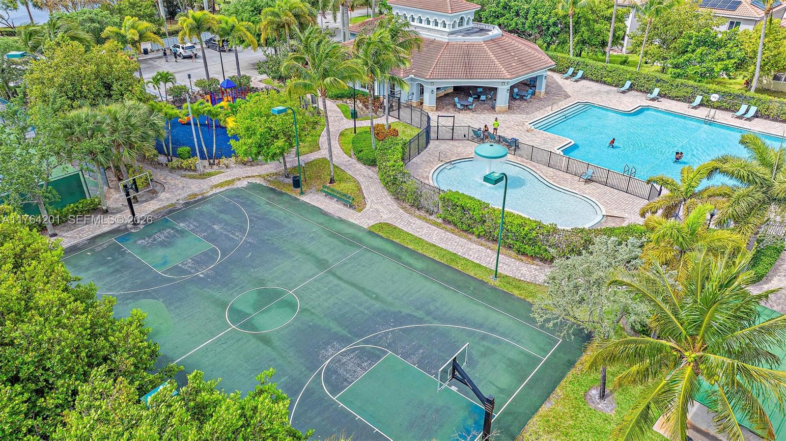 3229 Laurel Ridge Circle, Unit 3229 Riviera Beach, FL 33404 - Photo 16 of 24 an aerial view of a house with a garden and swimming pool