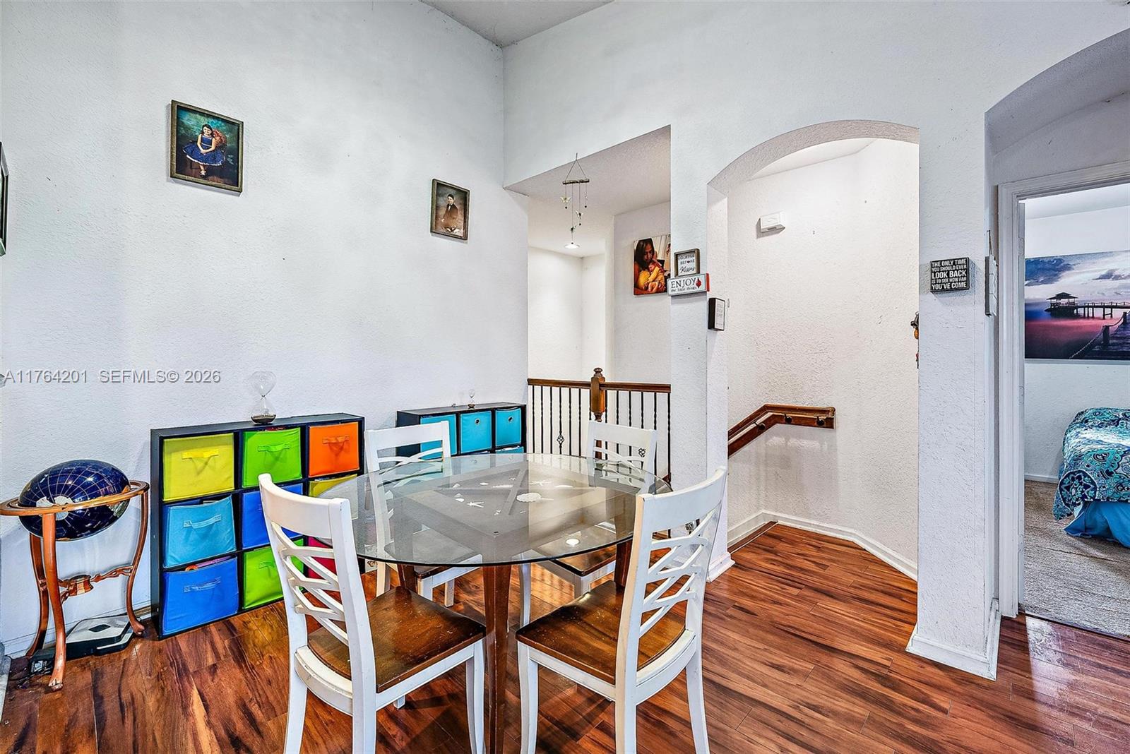 3229 Laurel Ridge Circle, Unit 3229 Riviera Beach, FL 33404 - Photo 6 of 24 a view of a dining room with furniture and wooden floor
