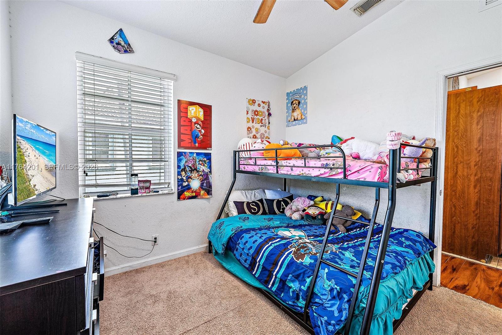 3229 Laurel Ridge Circle, Unit 3229 Riviera Beach, FL 33404 - Photo 10 of 24 a bedroom with bed and a window