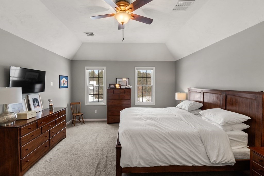 16 Michael Road Franklin, MA 02038 - Photo 20 of 39 a bedroom with a bed and a flat screen tv