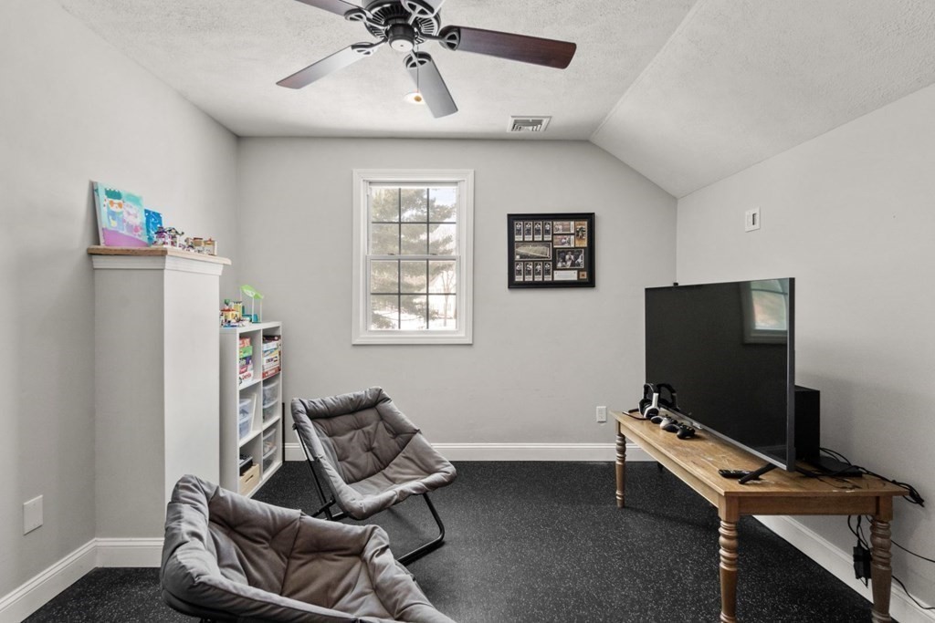 16 Michael Road Franklin, MA 02038 - Photo 26 of 39 a room with furniture and a flat screen tv