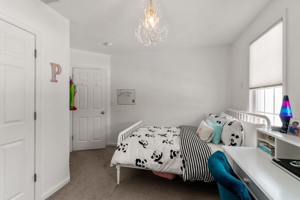 16 Michael Road Franklin, MA 02038 - Photo 30 of 39 a bedroom with a bed and a window