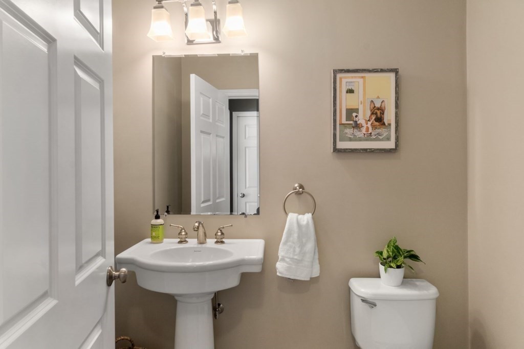 16 Michael Road Franklin, MA 02038 - Photo 8 of 39 a bathroom with a sink a mirror and a toilet