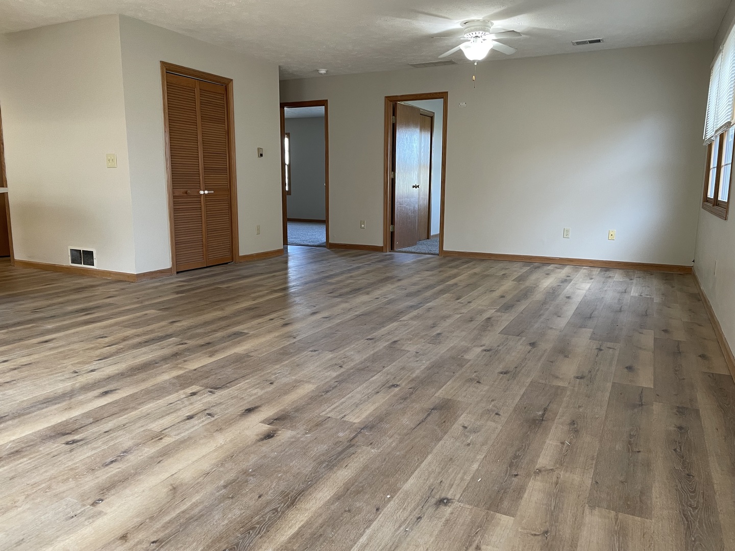 426 South Peace Road, Unit 426 Sycamore, IL 60178 - Photo 8 of 22 a view of an empty room and wooden floor