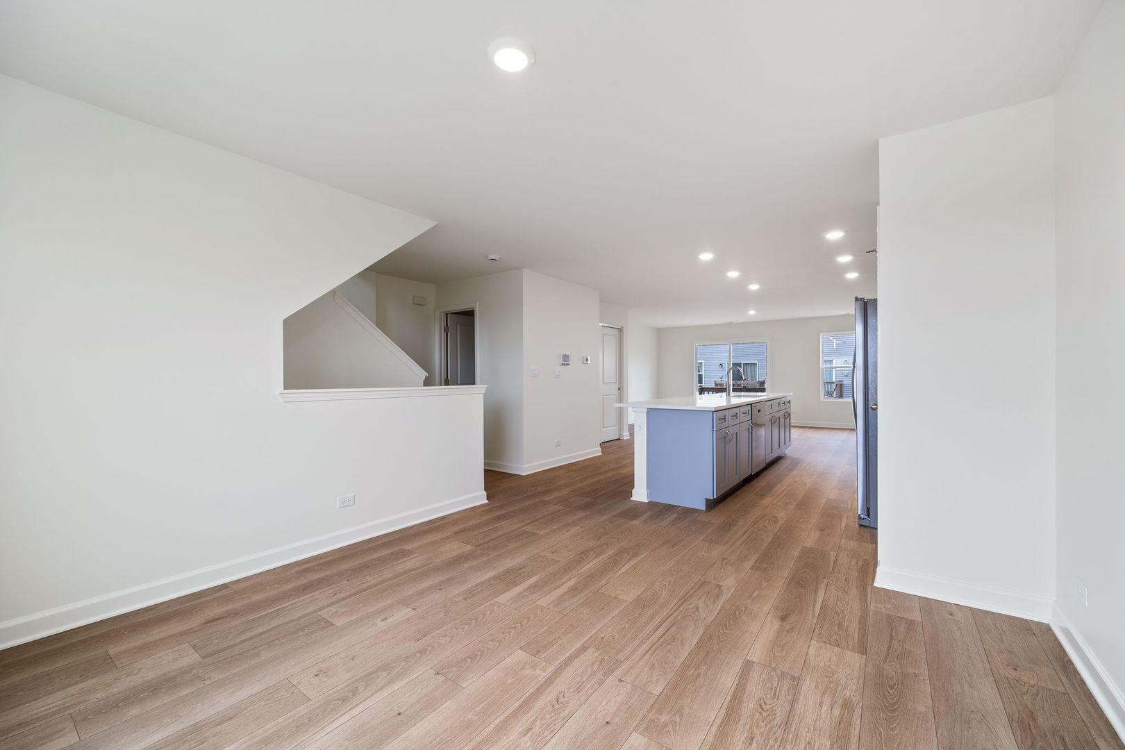 2463 BELLA Drive Pingree Grove, IL 60140 - Photo 12 of 24 a view of a kitchen with wooden floor and a sink